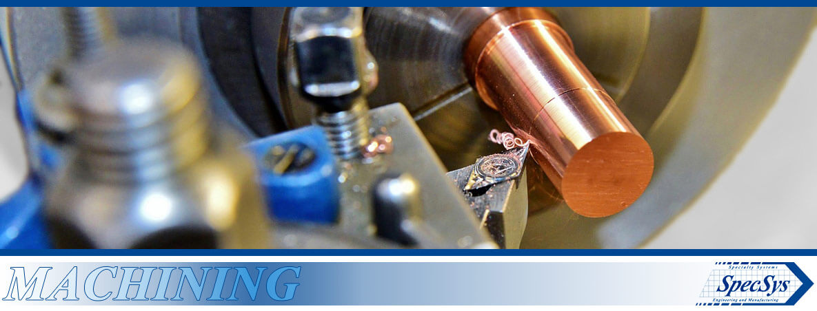 Machining - A copper shaft being machined on a manual lathe - SpecSys, Inc